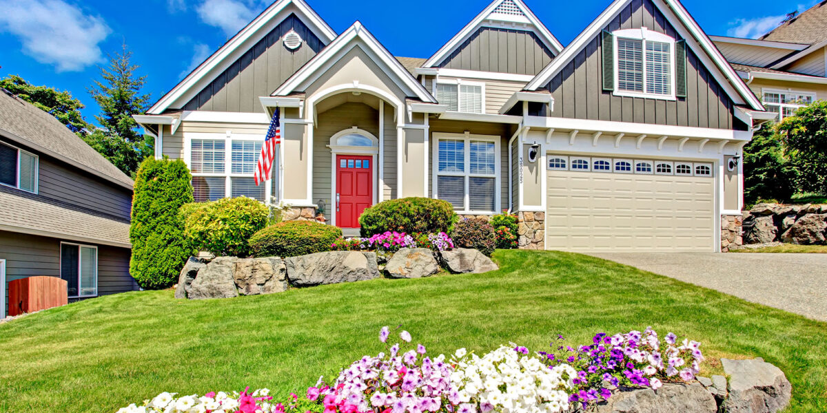 Beautiful suburban home with garden and blue sky