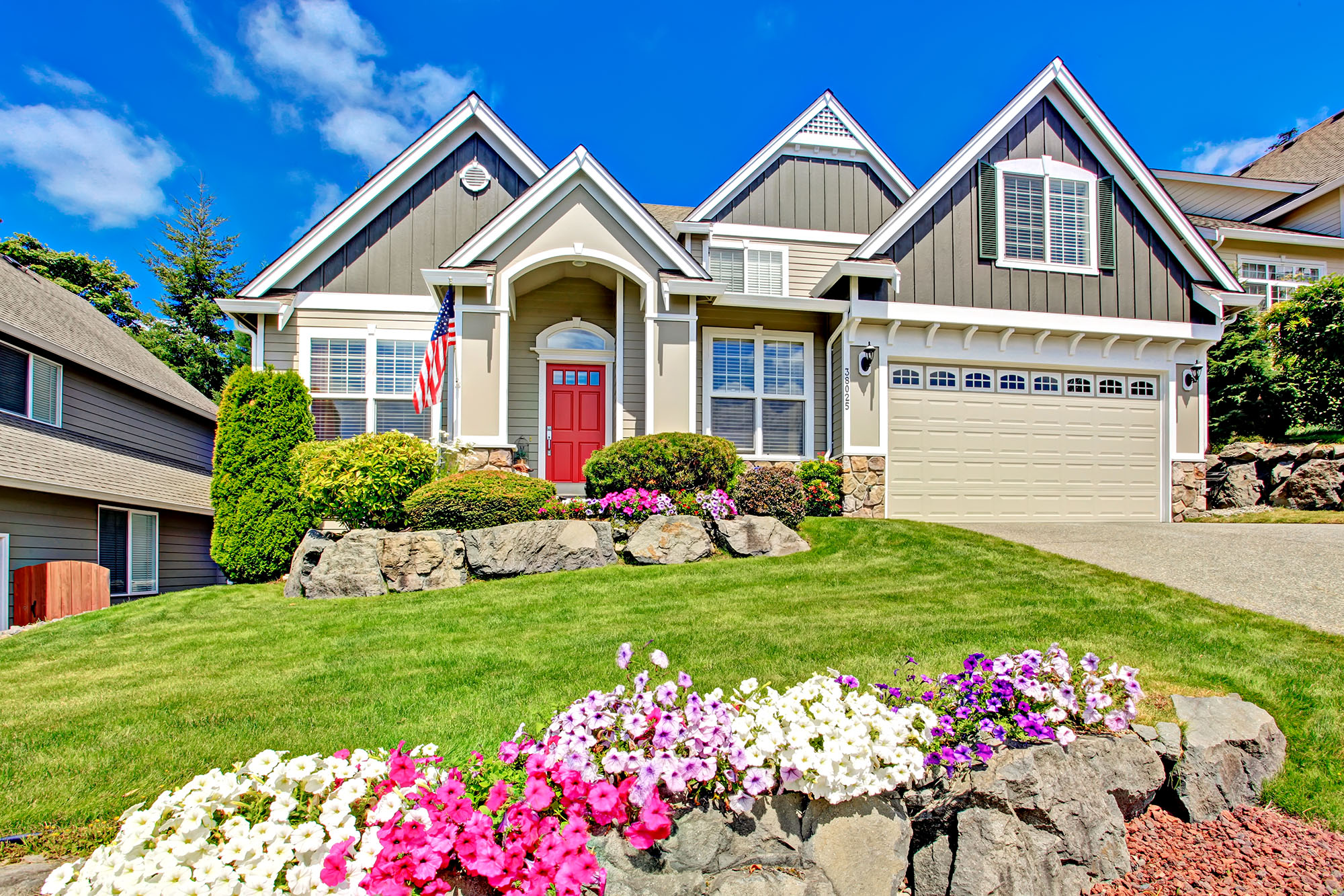 Beautiful suburban home with garden and blue sky