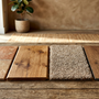 Variety of floor samples including tile, hardwood, carpet, and laminate in a showroom