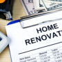 Home renovation list on clipboard with calculator and materials.