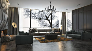 Great room with large windows with snow-covered tree outside.