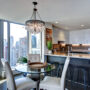 Modern condo kitchen with city skyline view