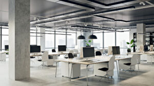 Modern open-plan office with sleek workstations and large windows