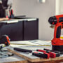 Red cordless drill and tools on kitchen renovation site