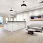 Modern reception renovation by UPPERAVENUE Construction Inc.