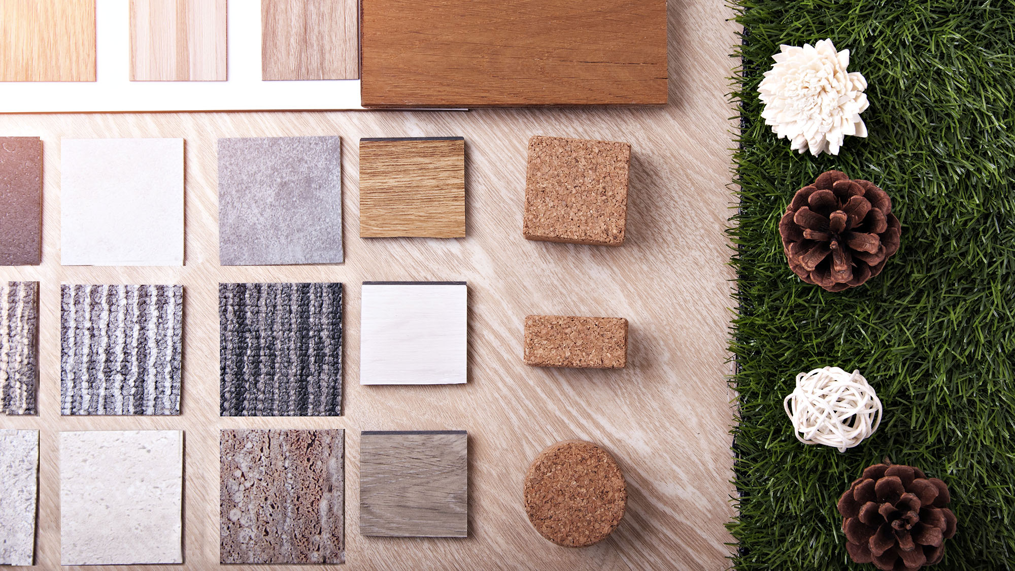 Interior design materials and textures with wood, fabric, and grass elements