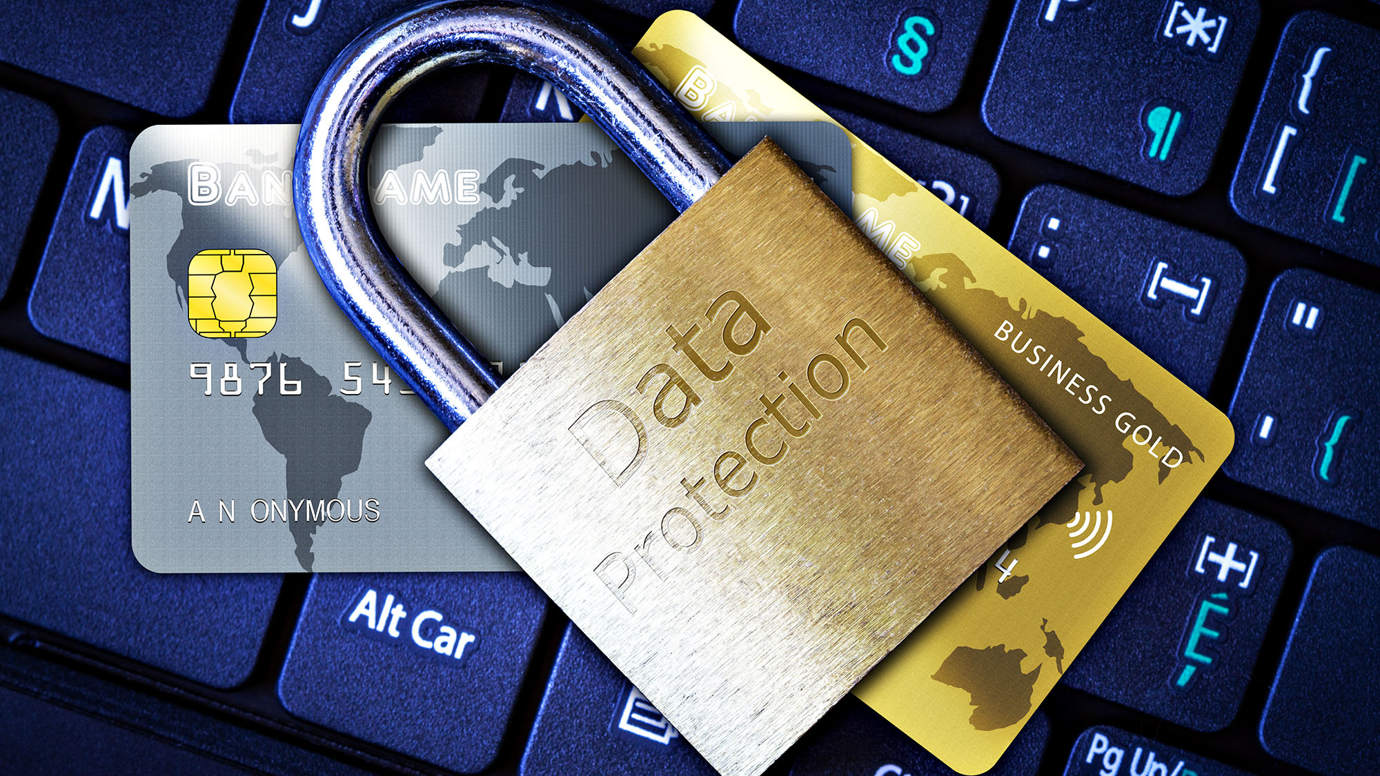 Data protection concept with padlock on credit cards and keyboard