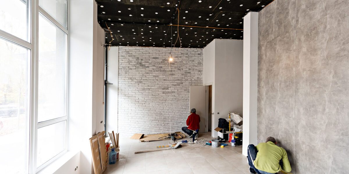 renovated room with shopping window - empty store shop with wooden floor and white walls