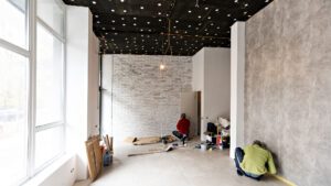 renovated room with shopping window - empty store shop with wooden floor and white walls