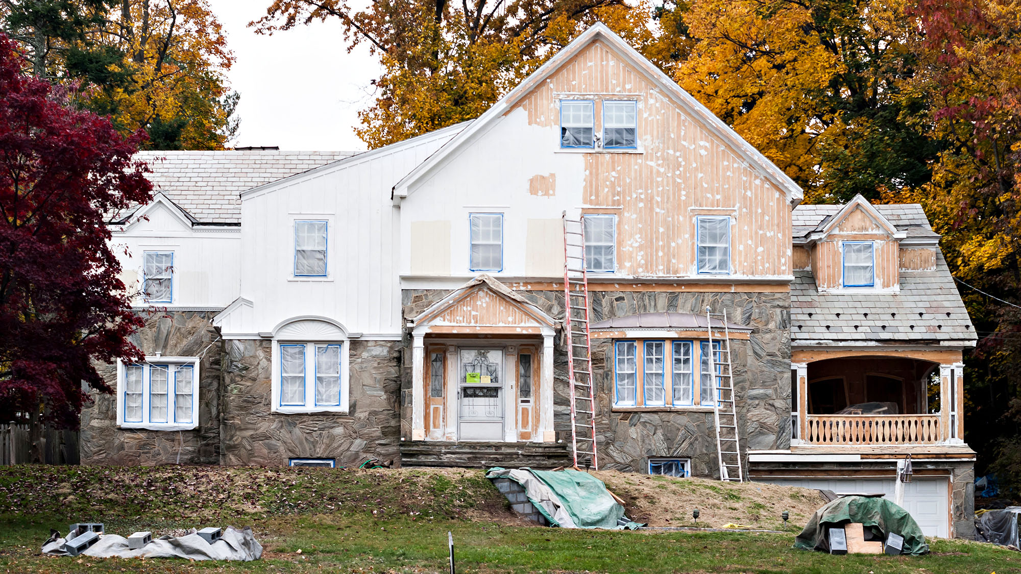 Partially renovated heritage house with autumn foliage