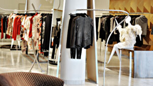 Elegant boutique showcasing luxury designer fashion pieces on racks