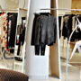 Elegant boutique showcasing luxury designer fashion pieces on racks