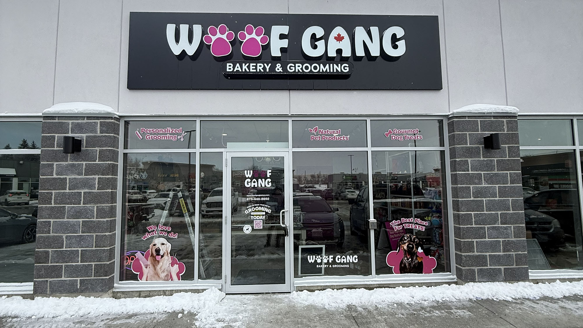 Woof Gang Bakery & Grooming storefront offering pet grooming and treats