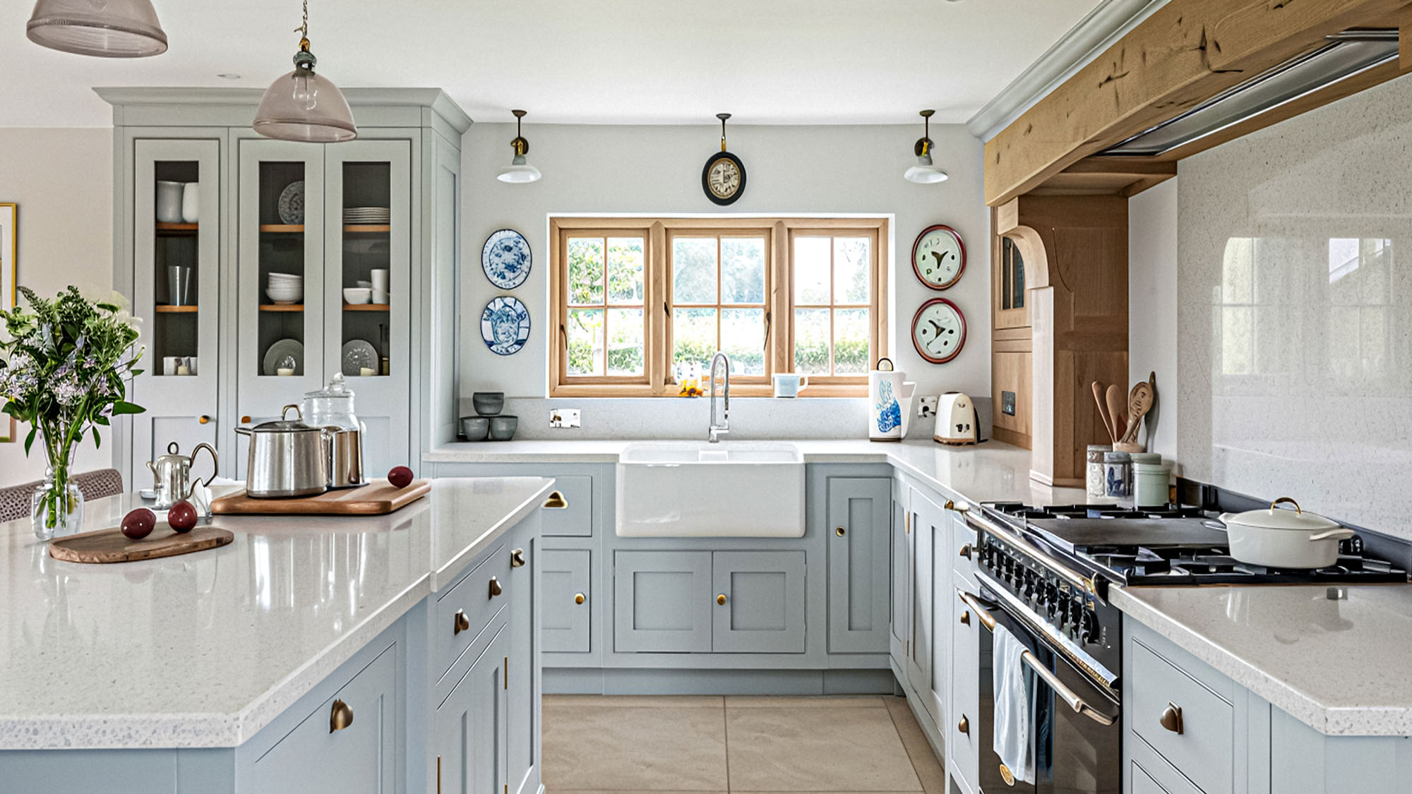 Spacious farmhouse kitchen with light cabinets and large island